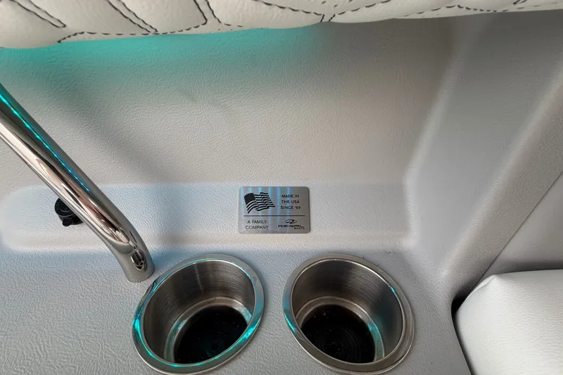 Slide: The Image of 2024 Regal LS9 interior detail with cup holders and USA-made label. - 15