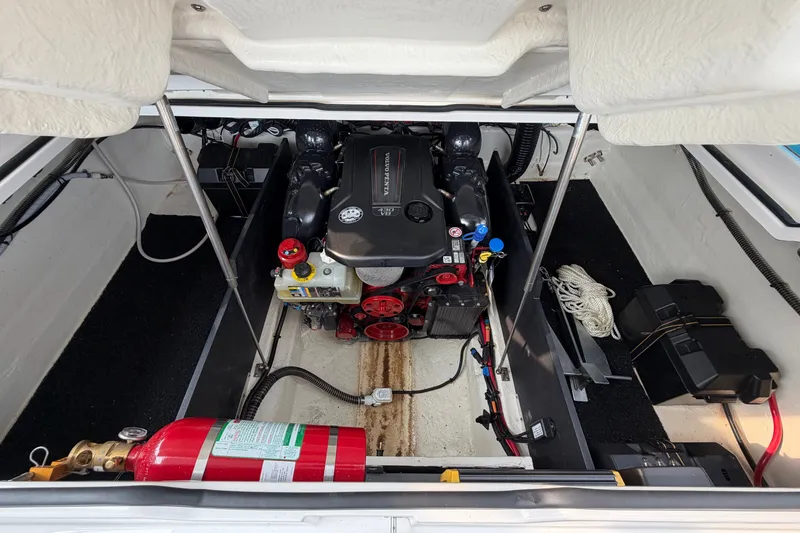 Slide: The Image of 2024 Regal LS9 engine compartment with fire extinguisher and battery, showcasing marine engineering. - 37