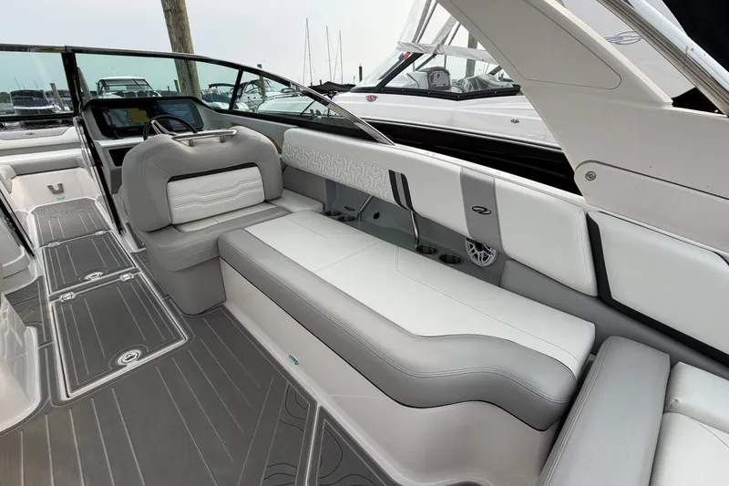 Slide: The Image of 2024 Regal LS9 boat interior with luxurious seating and modern design. - 11