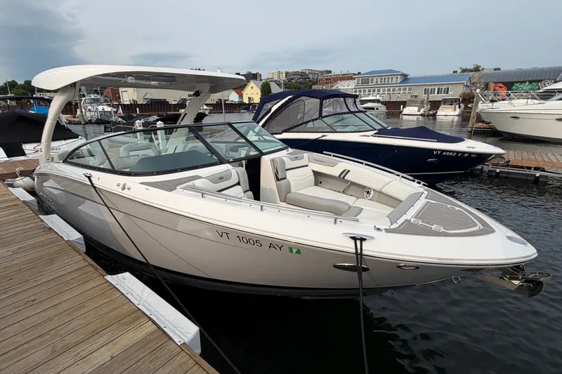 Slide: The Image of 2024 Regal LS9 boat docked at marina, showcasing sleek design and luxury features. - 4