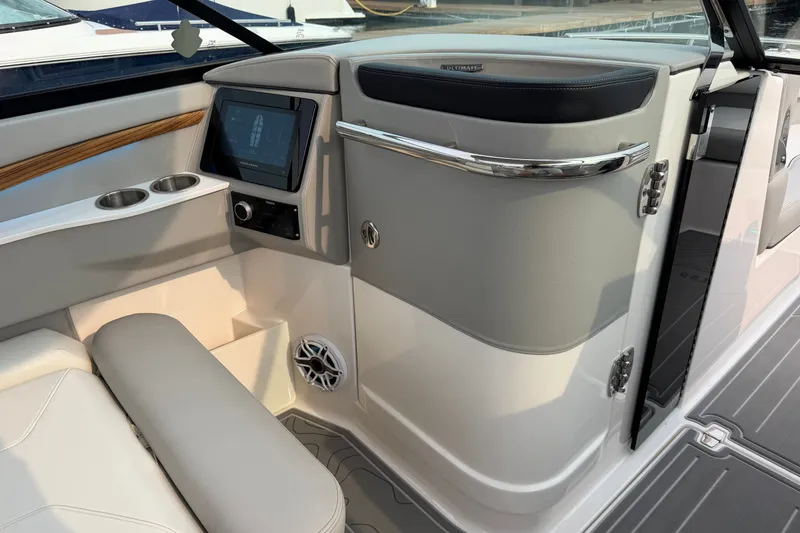 Slide: The Image of 2024 Regal LS9 boat interior with modern dashboard and seating. - 27