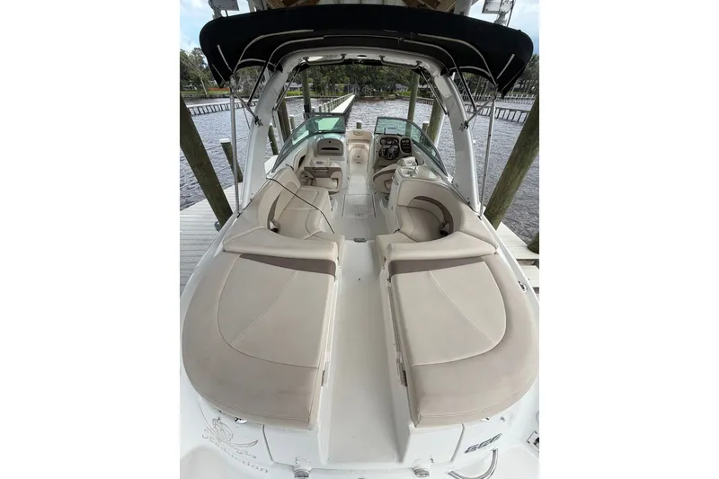 Slide: The Image of 2007 Chaparral 256 SSi boat interior with beige seating and black canopy. - 15