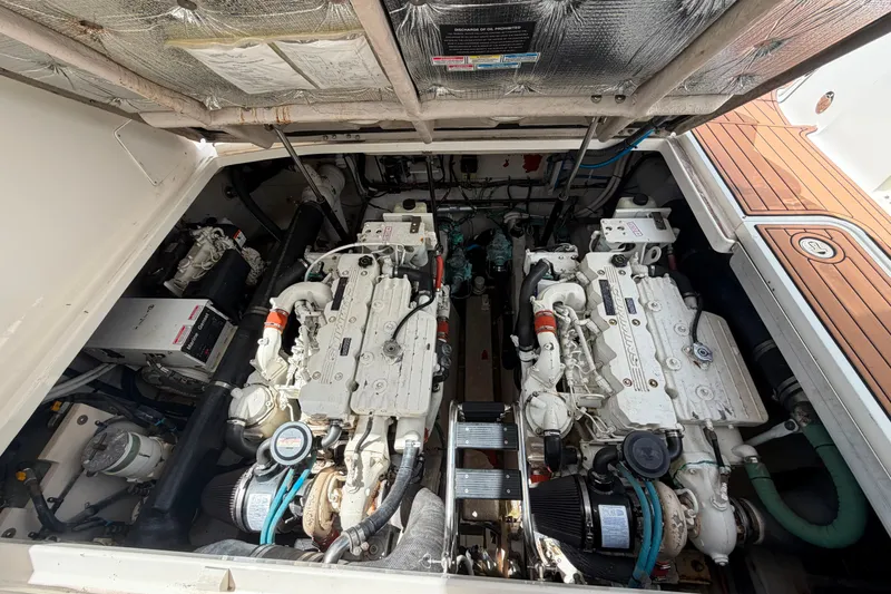 Slide: The Image of Engine compartment of a 2006 Sea Ray 40 Sundancer boat, showcasing dual engines. - 19
