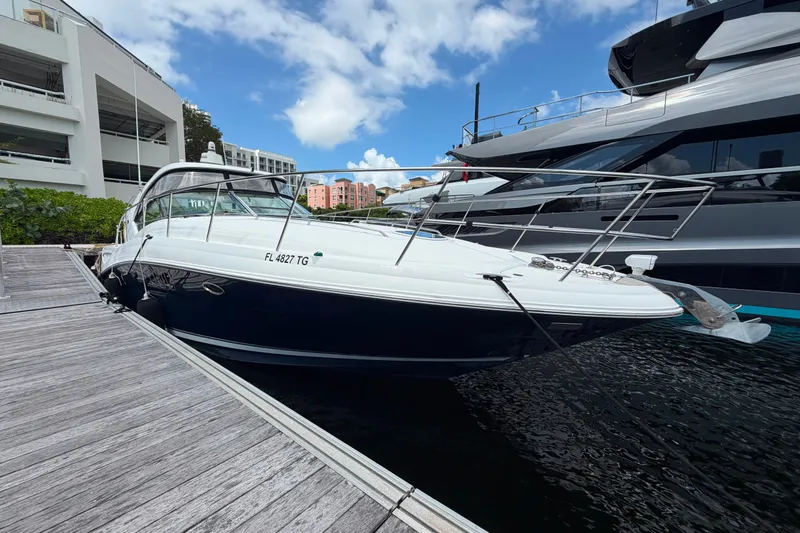 Slide: The Image of 2006 Sea Ray 40 Sundancer docked at marina under blue sky. - 20
