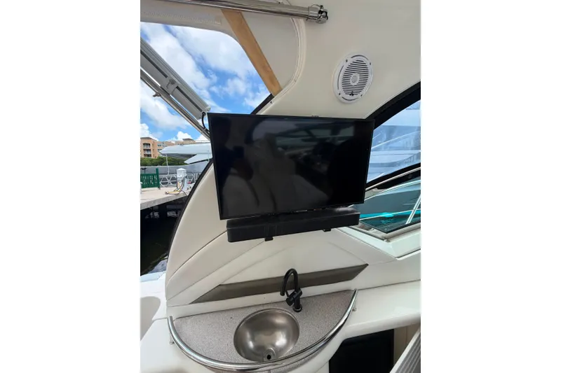 Slide: The Image of Interior of 2006 Sea Ray 40 Sundancer with TV and sink, docked at marina. - 16