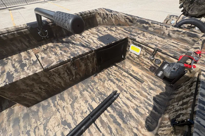 Slide: The Image of 2026 Excel 1751 Shallow Water F4 boat interior with camouflage design and control panel. - 20