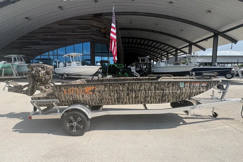 Slide: The Image of 2026 Excel 1751 Shallow Water F4 boat with camouflage design on a trailer. - 4