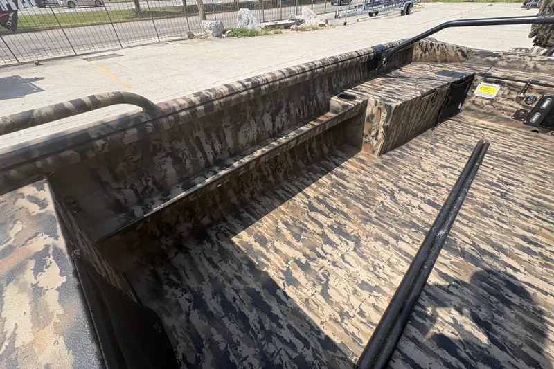 Slide: The Image of 2026 Excel 1751 Shallow Water F4 boat interior with camouflage design and seating. - 16