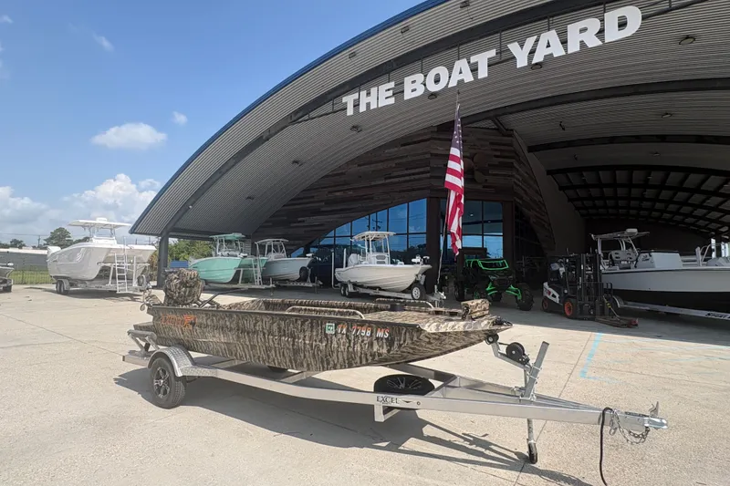 Slide: The Image of 2026 Excel 1751 Shallow Water F4 boat on trailer at The Boat Yard dealership. - 3