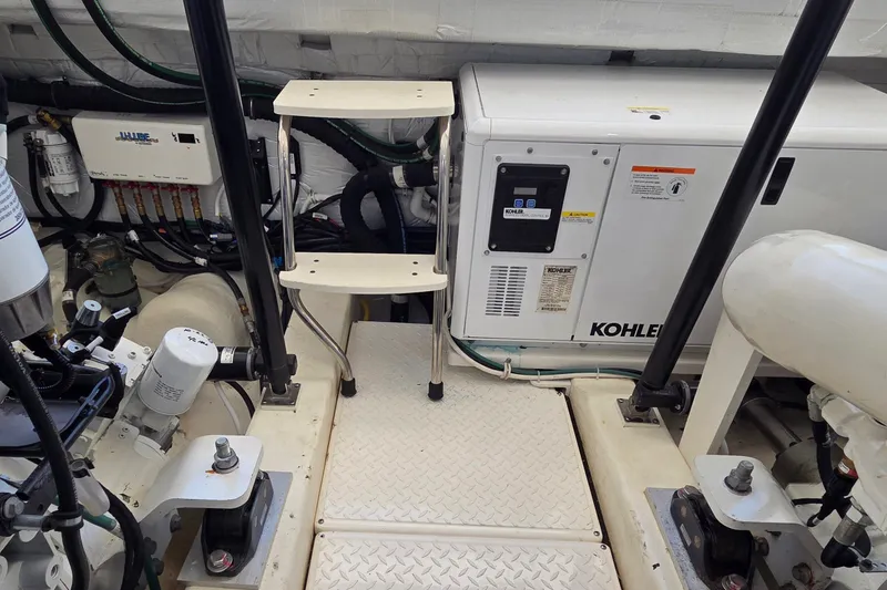 Slide: The Image of Engine room of 2023 Tiara Yachts 4300 Open with Kohler generator and equipment. - 33