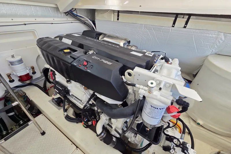 Slide: The Image of Engine compartment of 2023 Tiara Yachts 4300 Open, featuring a Volvo marine engine. - 31
