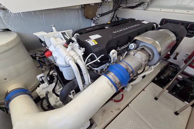 Slide: The Image of Engine room of 2023 Tiara Yachts 4300 Open, featuring Volvo Penta engine components. - 32