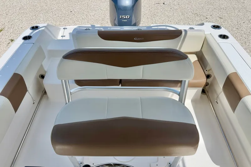 Slide: The Image of 2017 Robalo R200 Center Console boat interior with brown and white seating. - 14