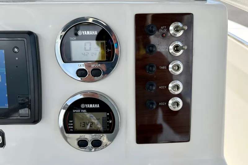 Slide: The Image of Dashboard of 2017 Robalo R200 Center Console with Yamaha gauges and control switches. - 19
