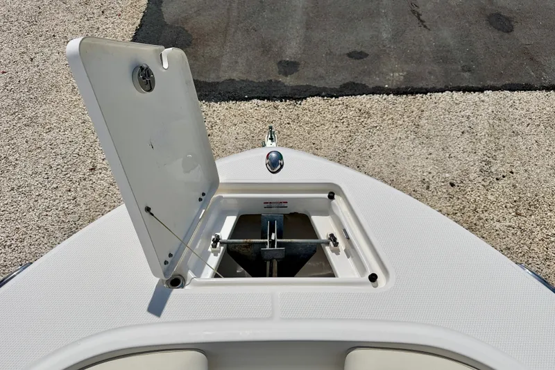 Slide: The Image of 2017 Robalo R200 Center Console anchor compartment open on deck. - 26