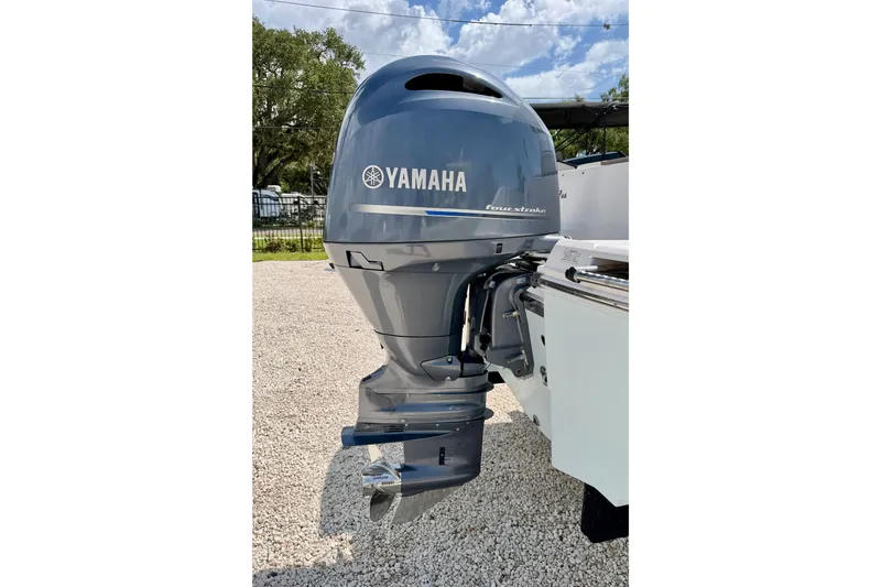 Slide: The Image of Yamaha outboard motor on 2017 Robalo R200 Center Console boat, parked on gravel. - 28