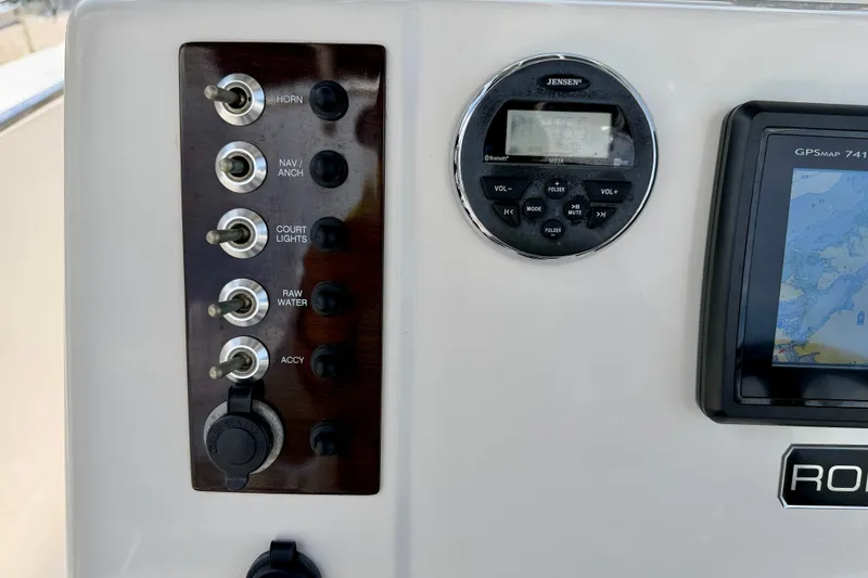 Slide: The Image of 2017 Robalo R200 Center Console dashboard with switches, GPS, and audio controls. - 20