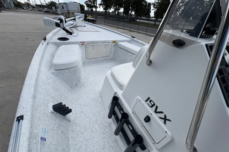 Slide: The Image of 2008 Kenner 19 VX boat with white interior and fishing rod holders. - 17
