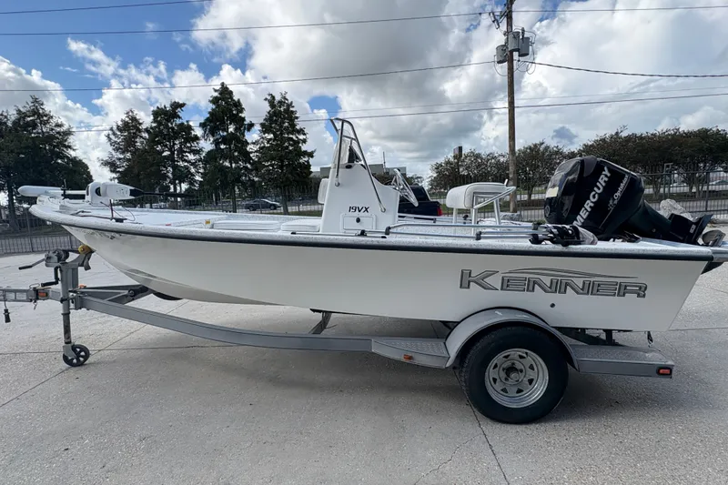 Slide: The Image of 2008 Kenner 19 VX boat on trailer with Mercury outboard motor. - 7