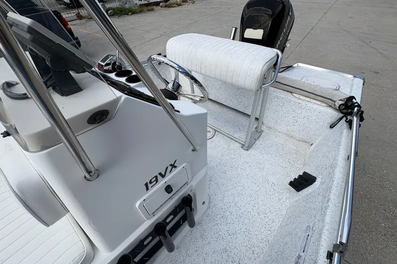 Slide: The Image of 2008 Kenner 19 VX boat interior with seating and steering console. - 14