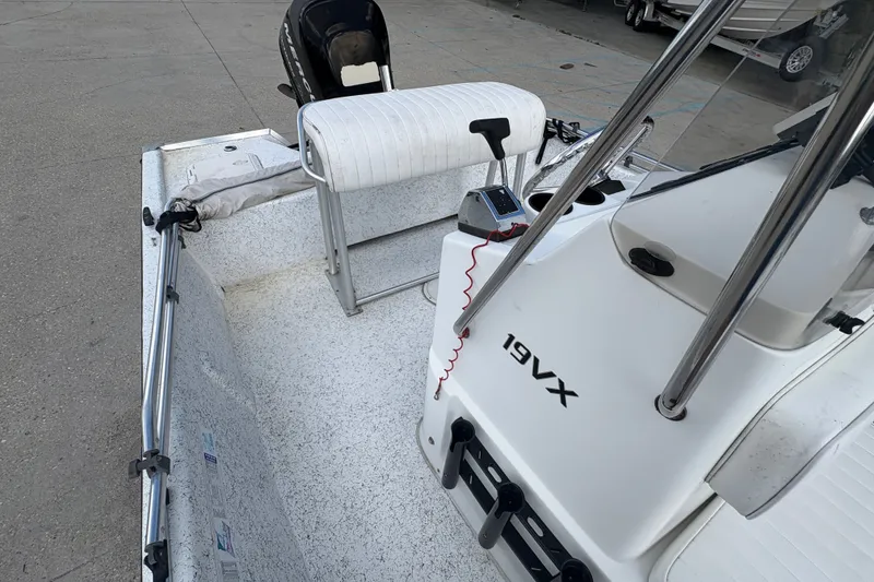 Slide: The Image of 2008 Kenner 19 VX boat interior with seating and control panel. - 13