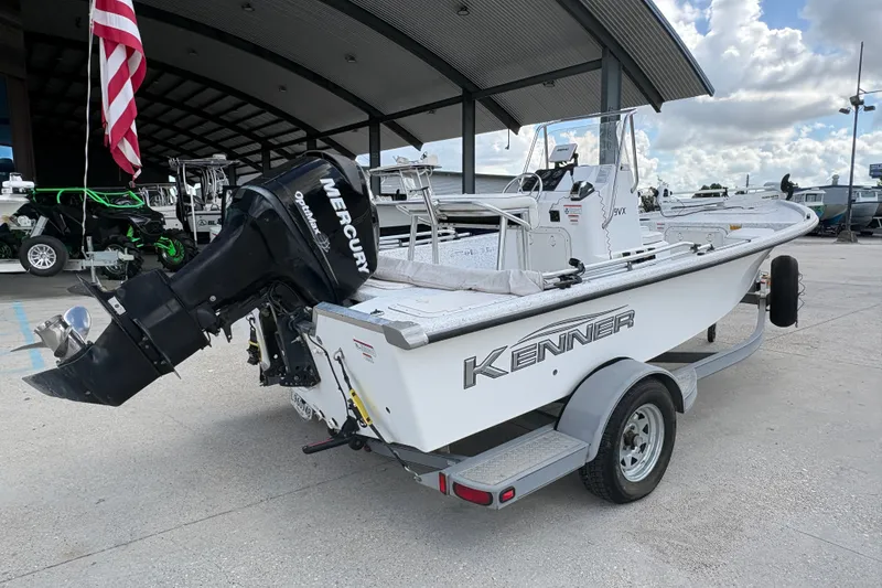 Slide: The Image of 2008 Kenner 19 VX boat with Mercury outboard motor on trailer. - 4