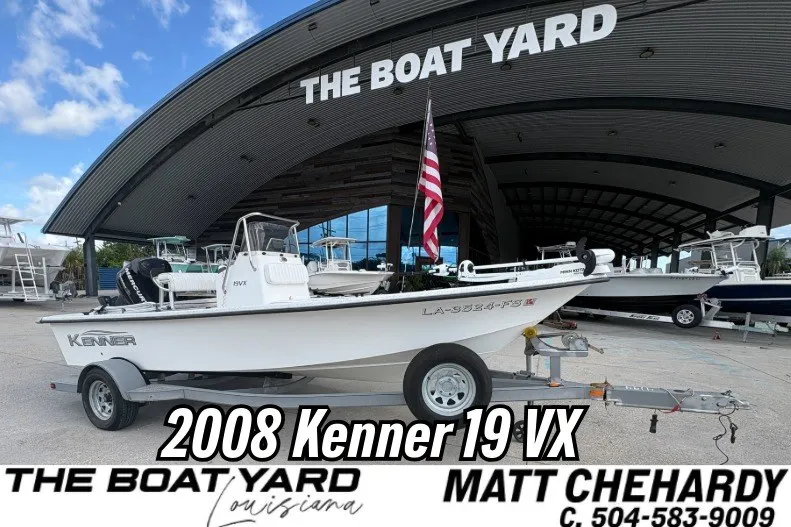 The Image of 2008 Kenner 19 VX boat displayed at The Boat Yard, Louisiana, with trailer and American flag. - 1