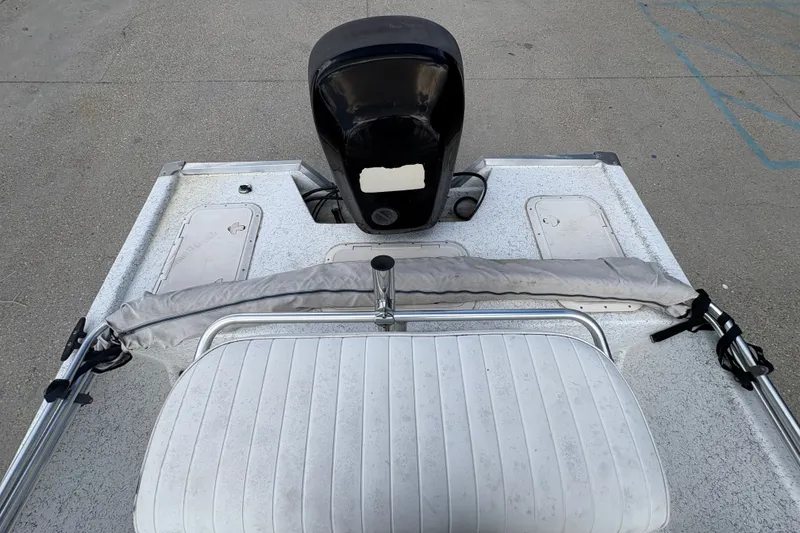 Slide: The Image of 2008 Kenner 19 VX boat interior with motor and seating. - 15