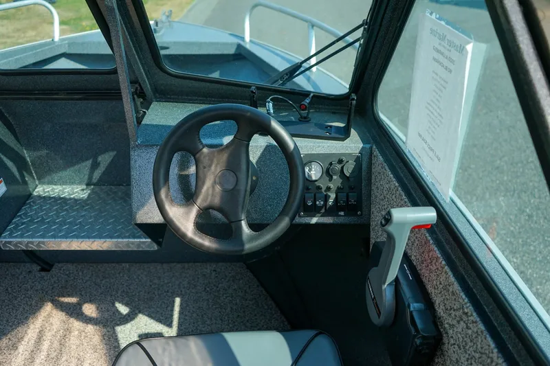 Slide: The Image of 2020 Alumaweld Blackhawk 180 boat interior with steering wheel and control panel. - 12