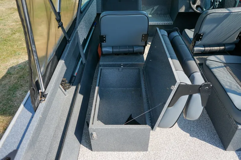 Slide: The Image of 2020 Alumaweld Blackhawk 180 boat interior with open storage compartment and seating. - 10