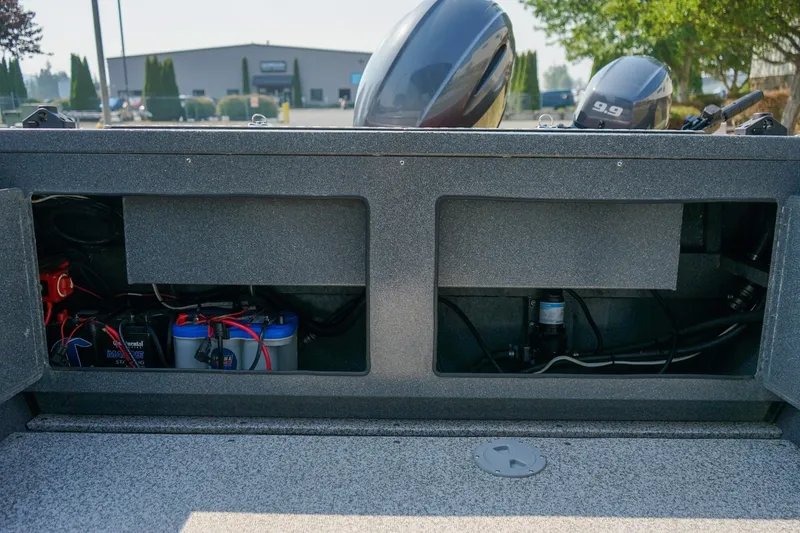 Slide: The Image of 2020 Alumaweld Blackhawk 180 boat interior showing battery compartment and wiring setup. - 8