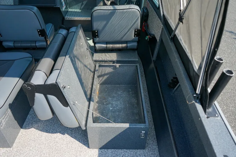 Slide: The Image of 2020 Alumaweld Blackhawk 180 boat interior with open storage compartment and seating. - 9