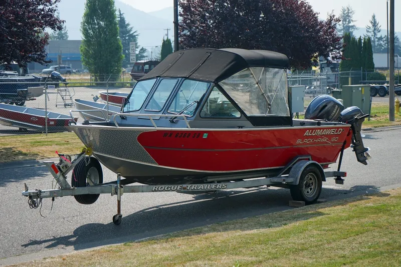 Slide: The Image of 2020 Alumaweld Blackhawk 180 boat on trailer, parked outdoors. - 15