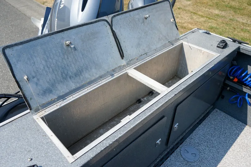Slide: The Image of Open storage compartment on 2020 Alumaweld Blackhawk 180 boat, showcasing interior space. - 7