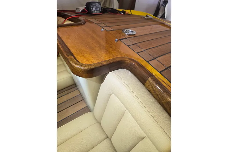Slide: The Image of Luxurious interior of 2025 Custom Line 17 boat with wood and leather details. - 19
