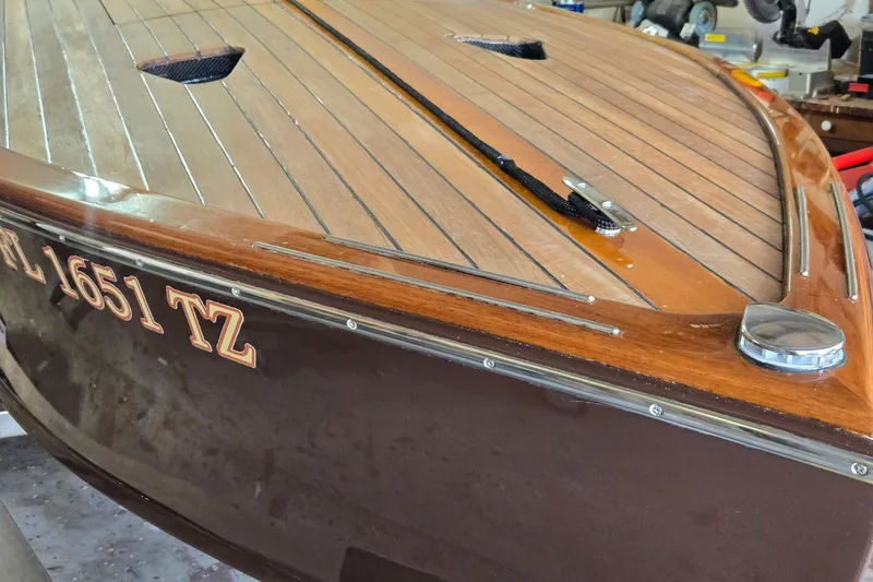 Slide: The Image of 2025 Florida Custom Boats 17 with wooden deck and registration FL 1651 TZ. - 13