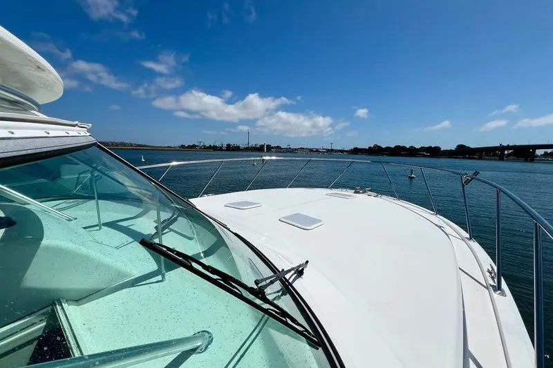 Slide: The Image of 1998 Viking 43 Open yacht cruising on a sunny day with clear blue skies. - 11