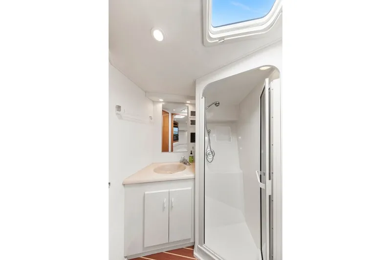Slide: The Image of Bathroom interior of 1998 Viking 43 Open yacht with shower and sink. - 15