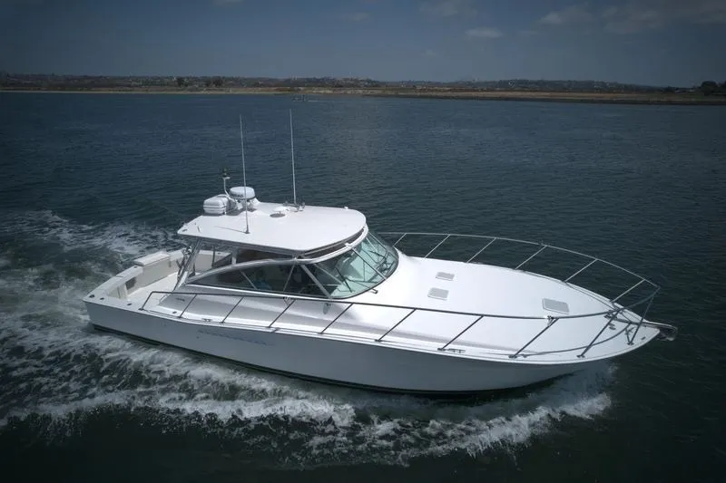 Slide: The Image of 1998 Viking 43 Open yacht cruising on calm waters. - 4