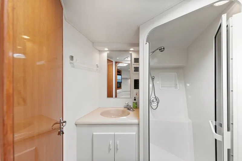 Slide: The Image of Bathroom interior of 1998 Viking 43 Open yacht with shower and sink. - 14