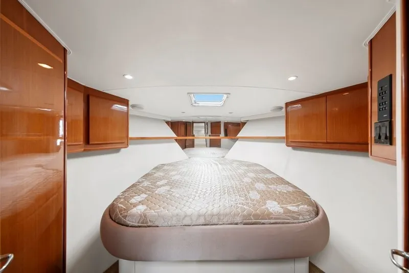 Slide: The Image of Luxurious cabin interior of 1998 Viking 43 Open yacht with wood cabinetry and skylight. - 16