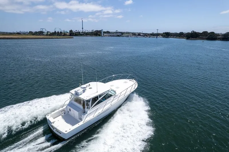 Slide: The Image of 1998 Viking 43 Open yacht cruising on a sunny day in open waters. - 3