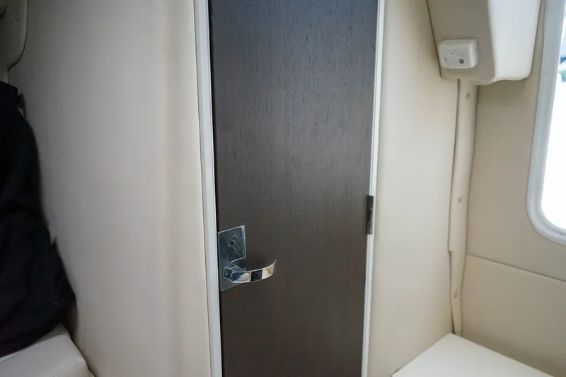 Slide: The Image of Interior cabin door of 2019 Striper 270 Walkaround boat. - 16