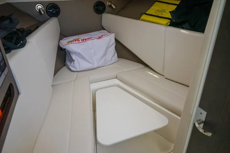 Slide: The Image of 2019 Striper 270 Walkaround cabin interior with seating and table. - 18