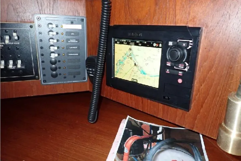 Slide: The Image of Navigation equipment on a 1987 Tartan 34-2 sailboat, featuring a GPS and control panel. - 9