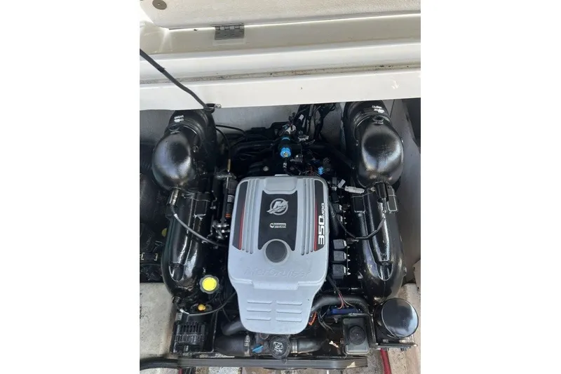 Slide: The Image of Engine compartment of a 2010 Sea Ray 260 Sundeck boat, featuring a MerCruiser 350 engine. - 27