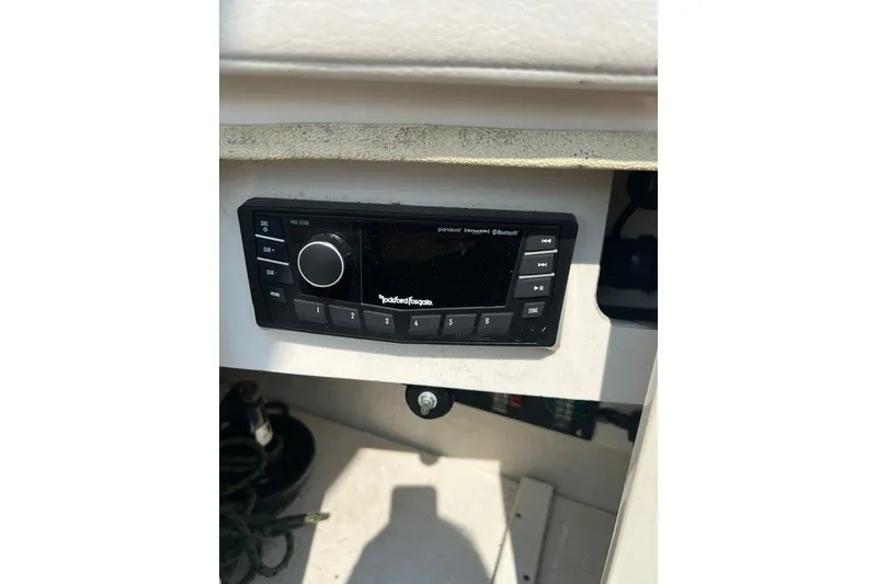 Slide: The Image of Rockford Fosgate stereo system on 2010 Sea Ray 260 Sundeck boat dashboard. - 23