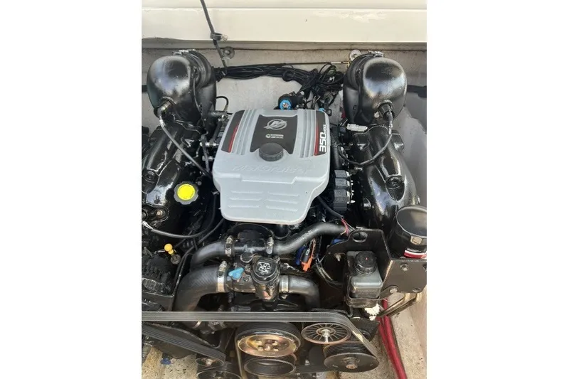 Slide: The Image of Engine of a 2010 Sea Ray 260 Sundeck boat, featuring a MerCruiser 350 engine. - 25