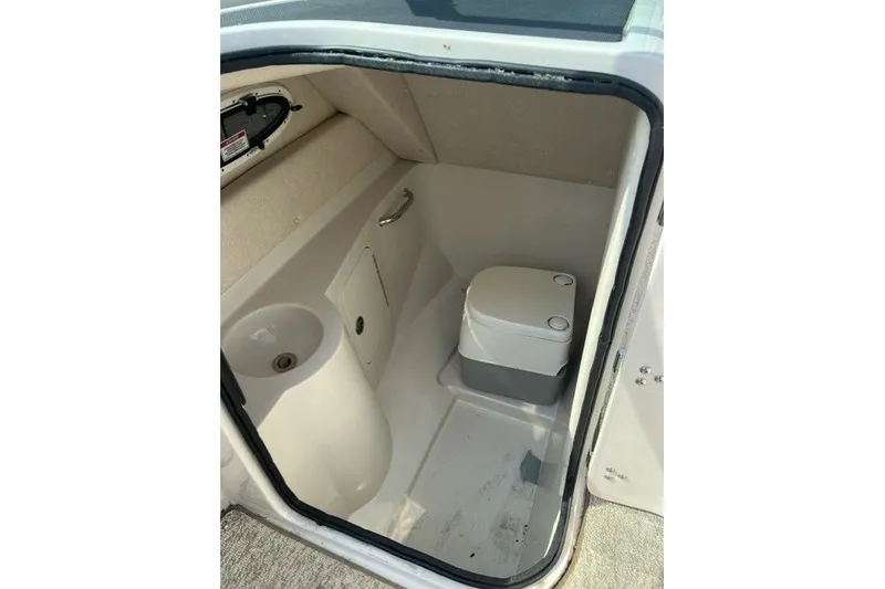 Slide: The Image of Interior of 2010 Sea Ray 260 Sundeck boat bathroom with compact toilet. - 20