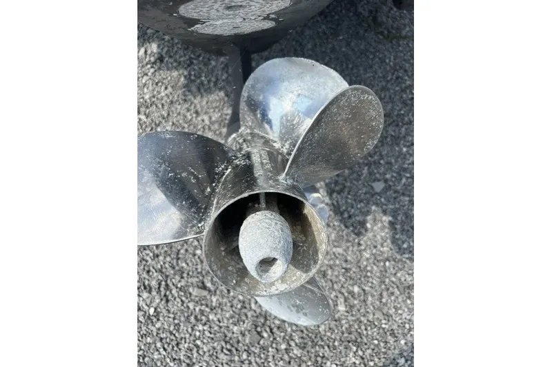 Slide: The Image of Propeller of 2010 Sea Ray 260 Sundeck on gravel surface. - 26